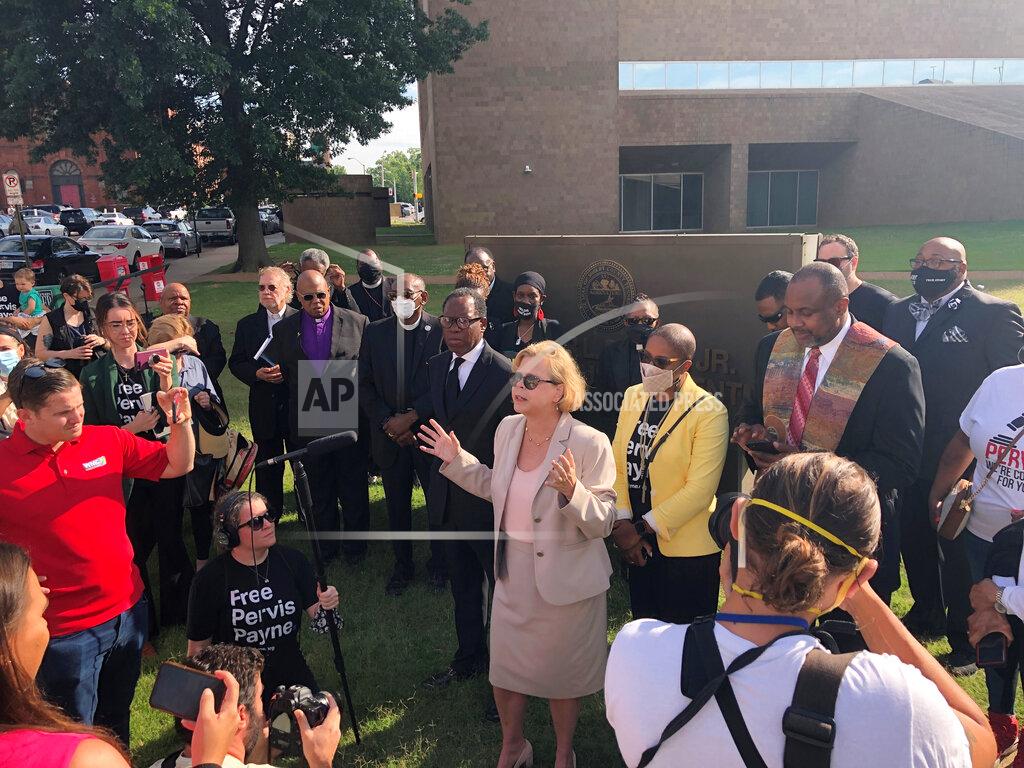 Adrian Sainz Attorney Kelley Henry, center, talks to supporters of her client, Tennessee death row inmate Pervis Payne, on Friday, June 4, 2021, in Memphis, Tenn. A judge ruled Friday that an expert hired by a state prosecutors' office can conduct a mental evaluation of Payne, who claims he is intellectually disabled and should not be executed. (AP Photo/Adrian Sainz)
