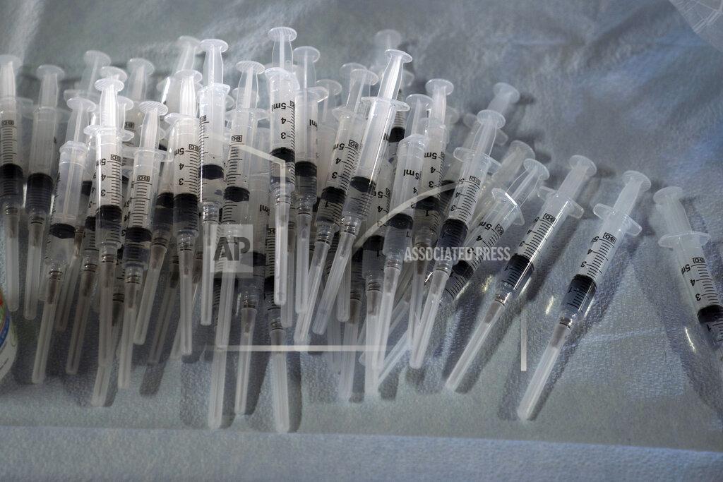 Jae C. Hong FILE - In this March 5, 2021, file photo, syringes prepared with Pfizer's COVID-19 vaccine sit at a vaccination site in Long Beach, Calif. The White House is pushing a new reason to swipe right: Dating apps are starting to offer vaccination badges and “super swipes” for people who've gotten their coronavirus shots. It's part of the administration's push to encourage COVID-19 vaccinations.(AP Photo/Jae C. Hong, File)