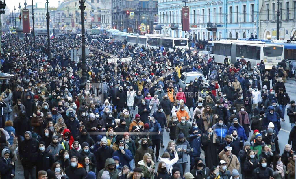 Dmitri Lovetsky People march during a protest against the jailing of opposition leader Alexei Navalny in St.Petersburg, Russia, Saturday, Jan. 23, 2021. Russian police are arresting protesters demanding the release of top Russian opposition leader Alexei Navalny at demonstrations in the country's east and larger unsanctioned rallies are expected later Saturday in Moscow and other major cities. (AP Photo/Dmitri Lovetsky)