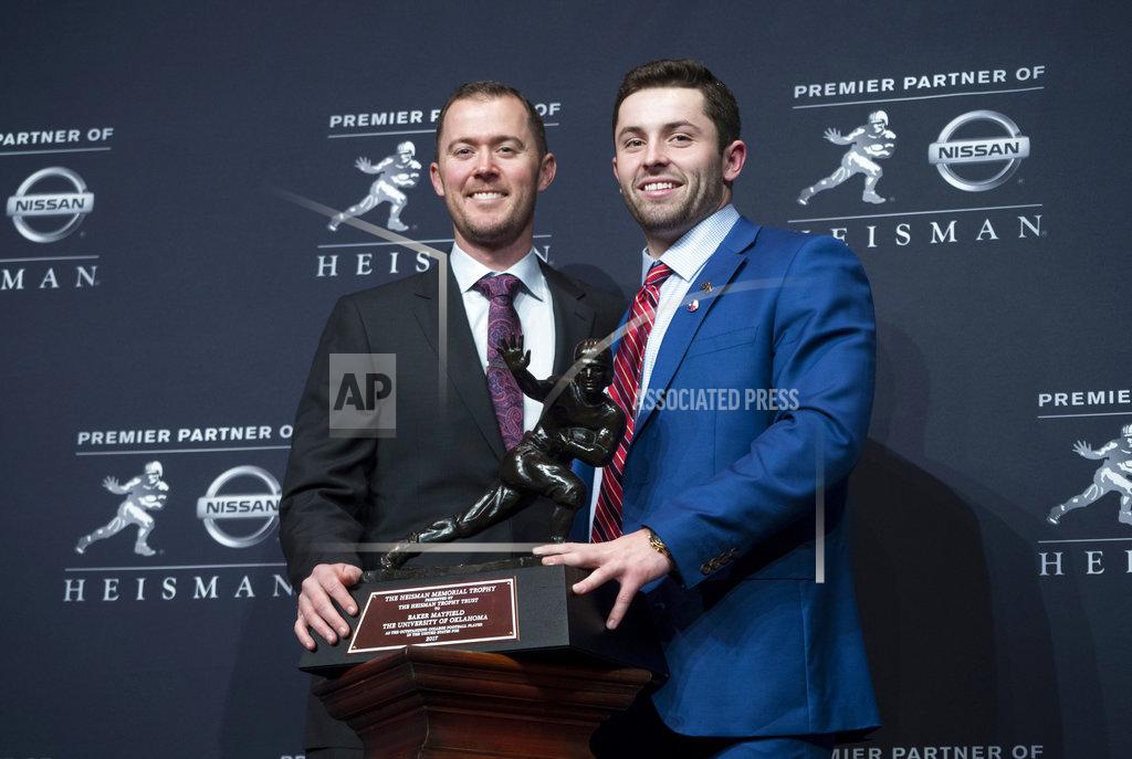 Craig Ruttle FILE - In this Dec. 9, 2017, file photo, Oklahoma head football coach Lincoln Riley, left, poses with Oklahoma quarterback Baker Mayfield, winner of the Heisman Trophy, during a news conference in New York. Oklahoma coach Lincoln Riley has been to the College Football Playoff twice and coached two Heisman winners since taking over as Oklahoma's coach 18 months ago. With all that success already at age 35, the school will have to battle to hold NFL teams at bay. (AP Photo/Craig Ruttle, File)