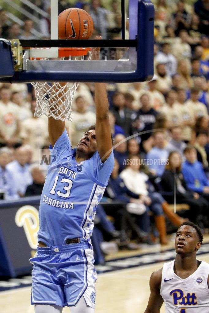 Keith Srakocic North Carolina's Cameron Johnson (13) dunks after getting by Pittsburgh's Xavier Johnson, right, during the second half of an NCAA college basketball game, Saturday, Jan. 5, 2019, in Pittsburgh. (AP Photo/Keith Srakocic)