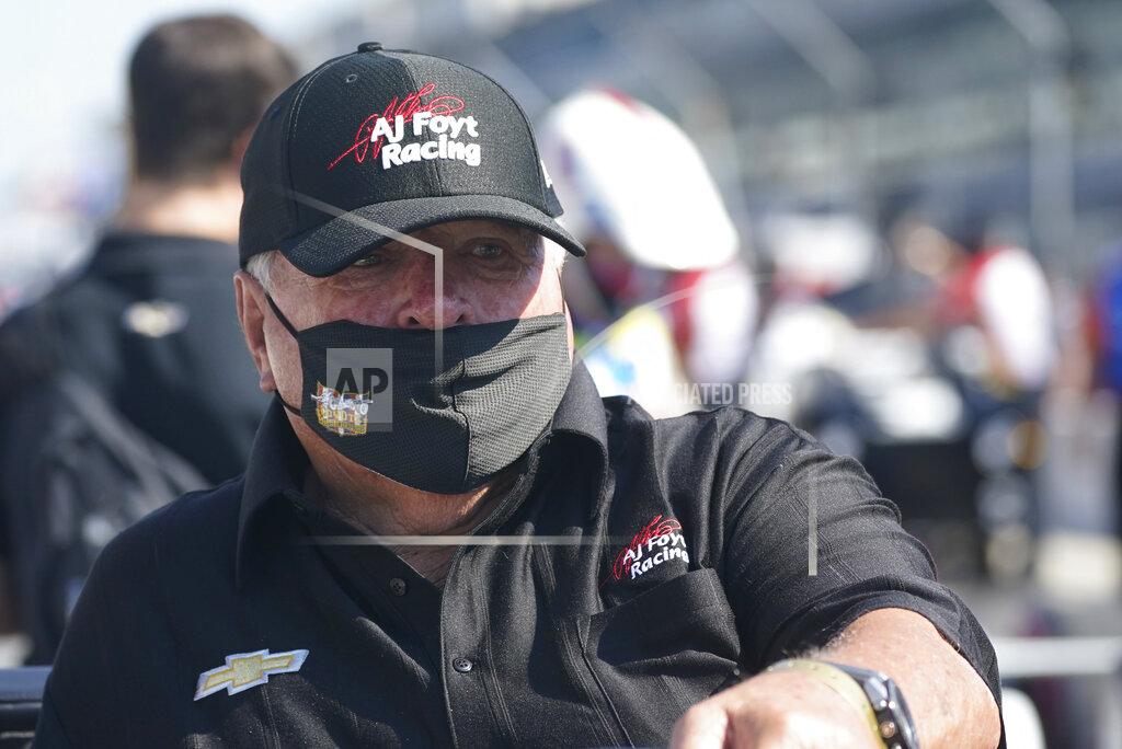 A.J. Foyt watches during qualifications for the Indianapolis 500 auto race at Indianapolis Motor Speedway, Saturday, Aug. 15, 2020, in Indianapolis. Even the seemingly indestructible 85-year-old, four-time Indianapolis 500 winner finds himself reluctantly wearing a mask and social distancing. (AP Photo/Darron Cummings)