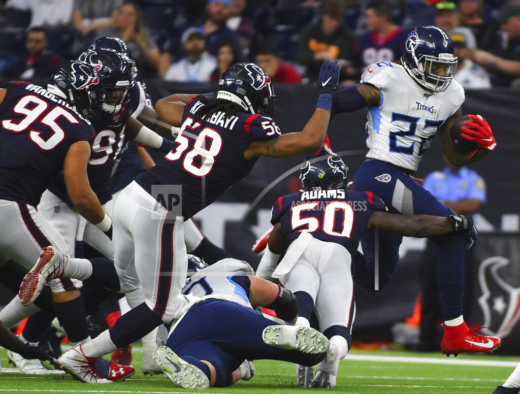 Eric Christian Smith Tennessee Titans running back Derrick Henry (22) rushes for a gain as Houston Texans linebacker Tyrell Adams (50) reaches to tackle him during the second half of an NFL football game Sunday, Dec. 29, 2019, in Houston. (AP Photo/Eric Christian Smith)