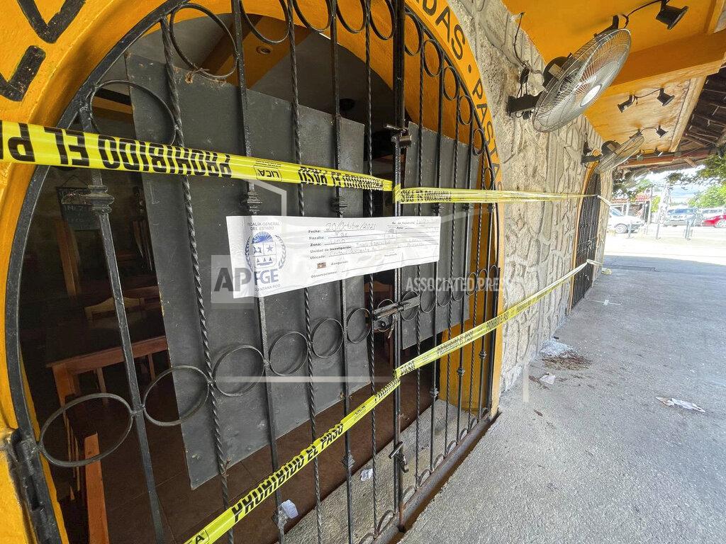 Christian Rojas Police security tape covers the entrance of a restaurant the day after a fatal shooting in Tulum, Mexico, Friday, Oct. 22, 2021. Two foreigners were killed and three wounded in a shooting in the Mexican Caribbean resort town of Tulum. (AP Photo/Christian Rojas)
