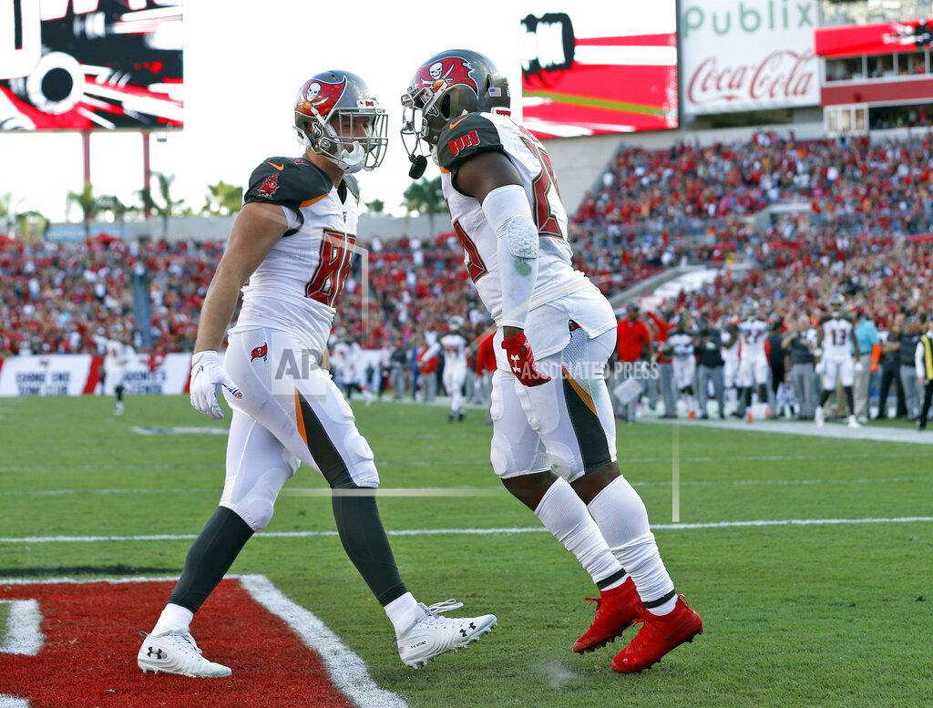 Mark Lomoglio Tampa Bay Buccaneers running back Peyton Barber, right, celebrates his touchdown against the Arizona Cardinals with tight end Tanner Hudson (88) during the second half of an NFL football game Sunday, Nov. 10, 2019, in Tampa, Fla. (AP Photo/Mark LoMoglio)