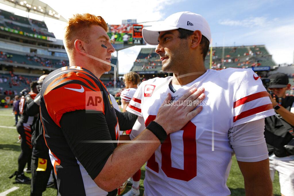 Frank Victores Cincinnati Bengals quarterback Andy Dalton, left, meets with San Francisco 49ers quarterback Jimmy Garoppolo, right, after an NFL football game Sunday, Sept. 15, 2019, in Cincinnati. (AP Photo/Frank Victores)