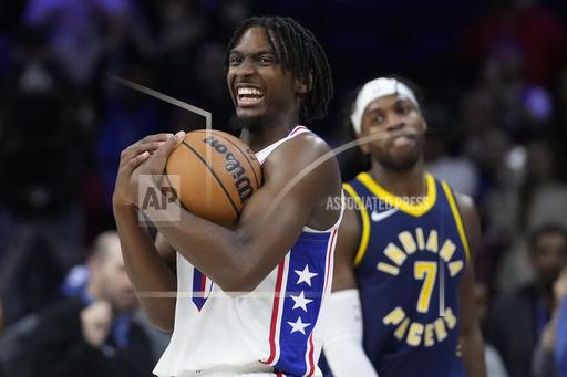 Philadelphia 76ers' Tyrese Maxey reacts past Indiana Pacers' Buddy Hield in the final minute of an NBA basketball game, Sunday, Nov. 12, 2023, in Philadelphia. (AP Photo/Matt Slocum)
