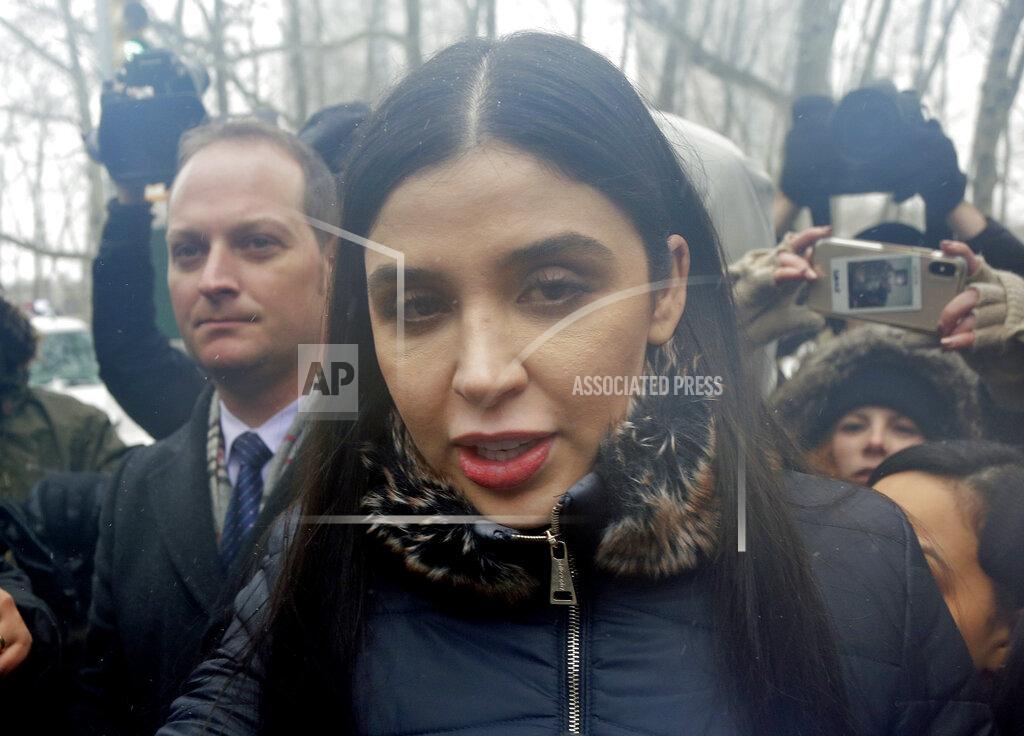 Seth Wenig FILE - In this Feb. 12, 2019 file photo, Emma Coronel Aispuro, center, wife of Joaquin "El Chapo" Guzman, leaves federal court in New York. The wife of Mexican drug kingpin and escape artist Joaquin “El Chapo” Guzman has been arrested on international drug trafficking charges at an airport in Virginia. The Justice Department says 31-year-old Emma Coronel Aispuro, who is a dual citizen of the U.S. and Mexico, was arrested at Dulles International Airport on Monday and is expected to appear in federal court in Washington on Tuesday. (AP Photo/Seth Wenig)
