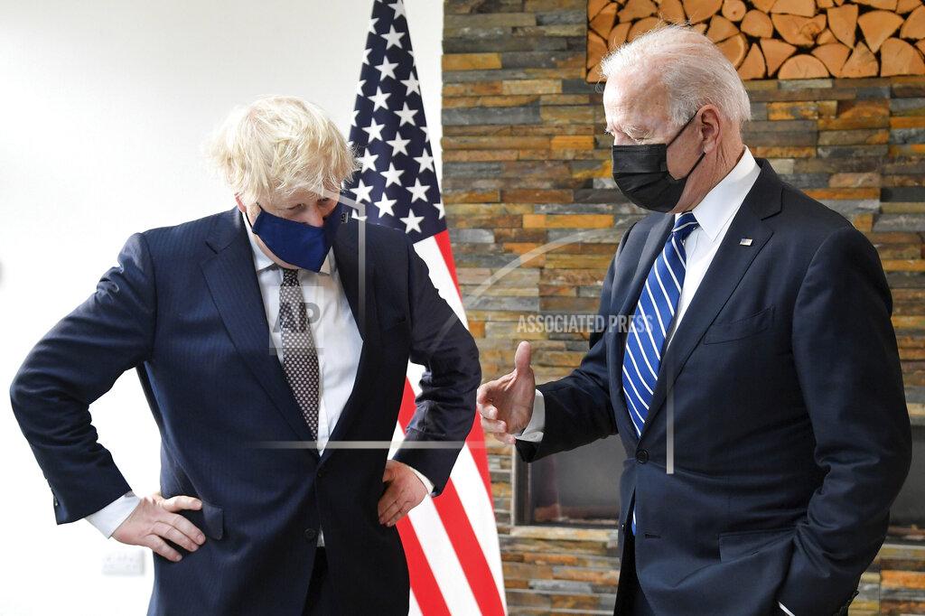 Toby Melville US President Joe Biden, right, talks with Britain's Prime Minister Boris Johnson, during their meeting ahead of the G7 summit in Cornwall, Britain, Thursday June 10, 2021. (Toby Melville/Pool Photo via AP)