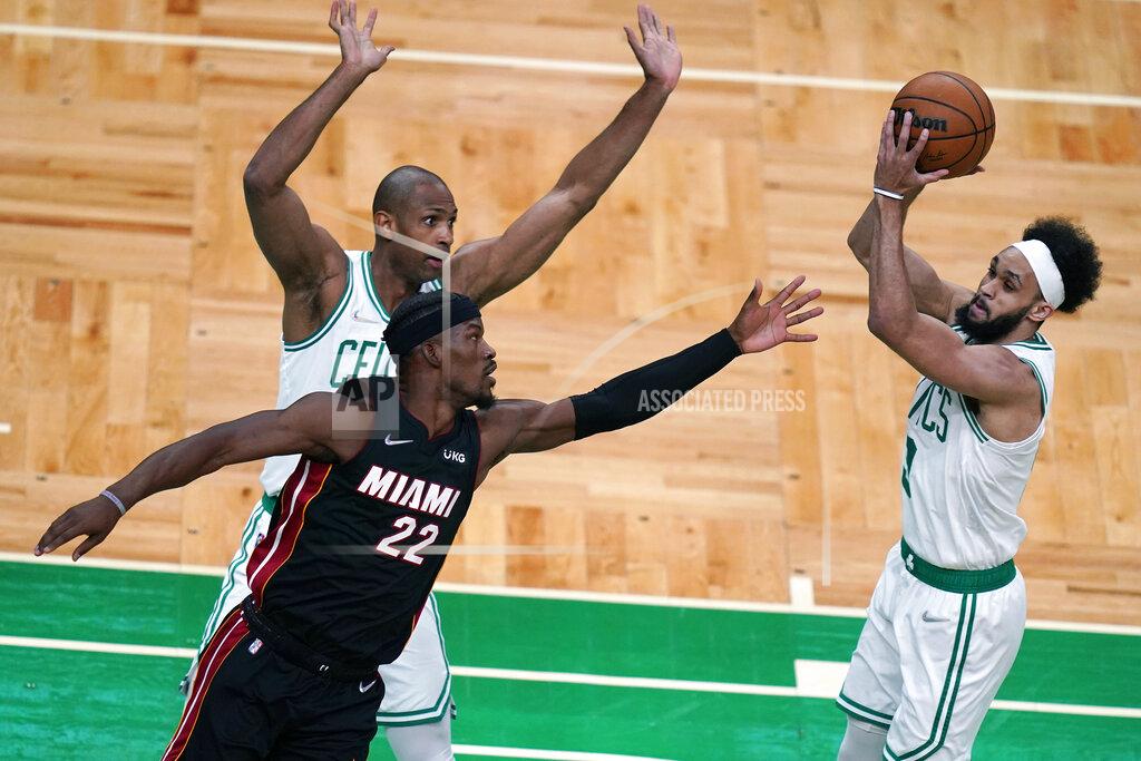 Charles Krupa Boston Celtics guard Derrick White, right, grabs a rebound against Miami Heat forward Jimmy Butler (22) during the first half of Game 4 of the NBA basketball playoffs Eastern Conference finals, Monday, May 23, 2022, in Boston. (AP Photo/Charles Krupa)