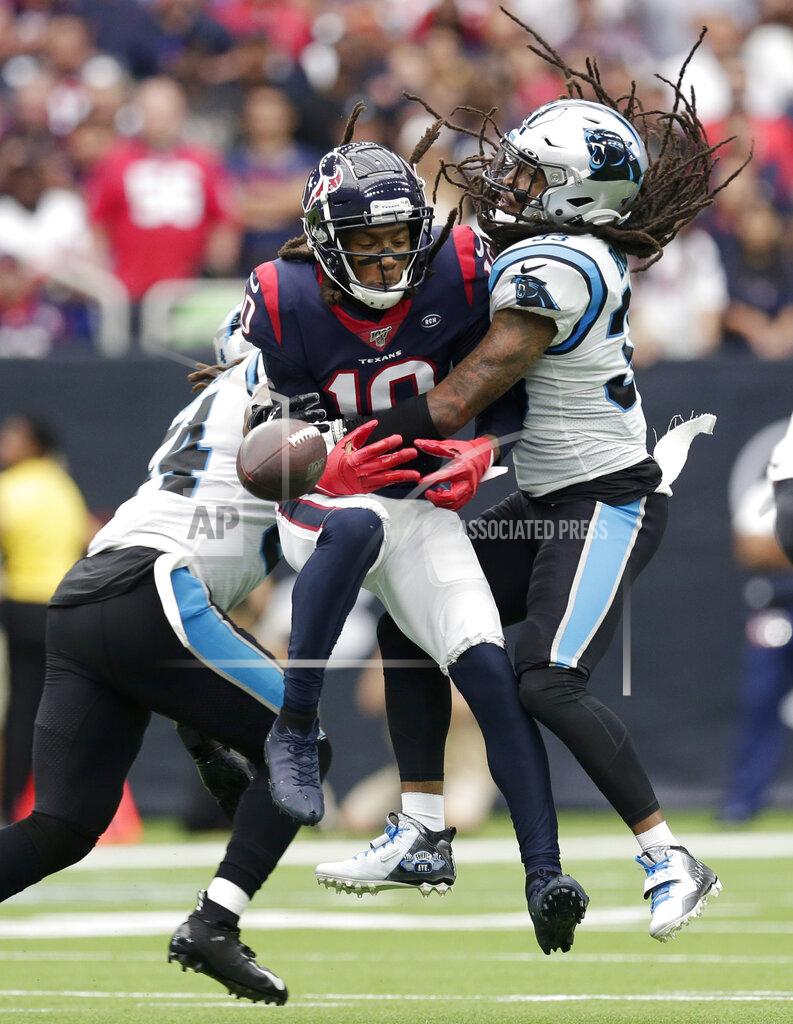 Michael Wyke Carolina Panthers defensive back Tre Boston (33) breaks up a pass intended for Houston Texans wide receiver DeAndre Hopkins (10) during the first half of an NFL football game Sunday, Sept. 29, 2019, in Houston. (AP Photo/Michael Wyke)