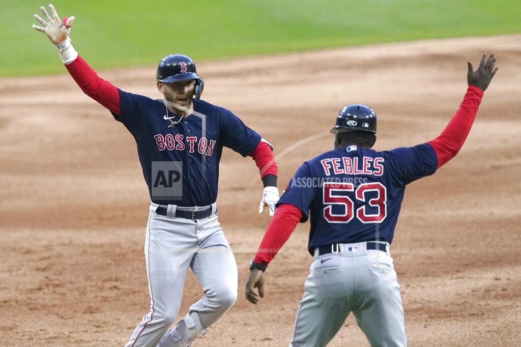 Charles Rex Arbogast Boston Red Sox's Trevor Story, left, celebrates his three-run home run off Chicago White Sox starting pitcher Dylan Cease with third base coach Carlos Febles during the first inning of a baseball game Tuesday, May 24, 2022, in Chicago. (AP Photo/Charles Rex Arbogast)