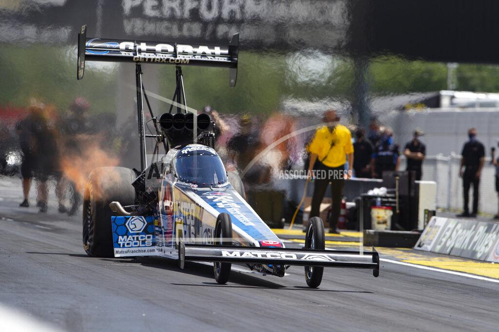 Michael Conroy Antron Brown makes a practice run in Top Fuel for the NHRA drag racing event in Brownsburg, Ind., Friday, July 10, 2020. The NHRA returned to action last weekend near Indianapolis, in front of fans, on network television and amid hopes of a quick financial rebound following a 138-day season suspension. It was the kind of boost everybody needed. Teams and crew members are scrambling to pay the bills. Big questions remain for the world's premier drag-racing series. The pandemic is still a threat to disrupt the season or shut it down again. (AP Photo/Michael Conroy)