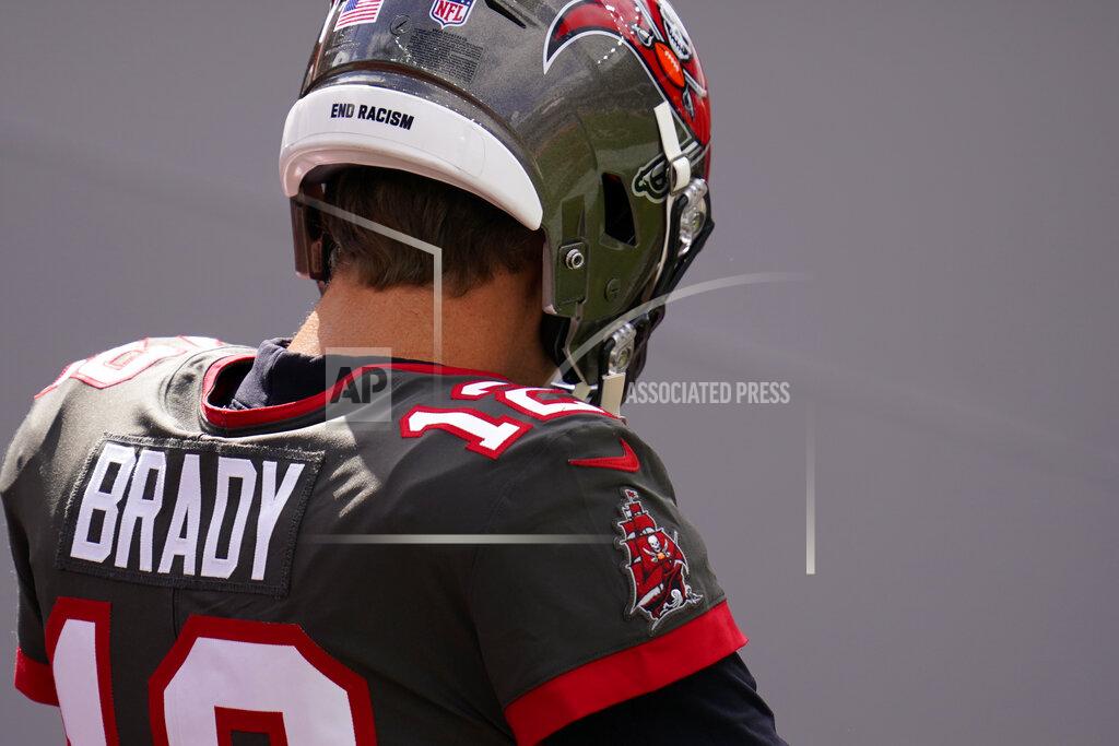 David Zalubowski Tampa Bay Buccaneers quarterback Tom Brady wears the words, "end racism" on his helmet before an NFL football game against the Denver Broncos, Sunday, Sept. 27, 2020, in Denver. (AP Photo/David Zalubowski)
