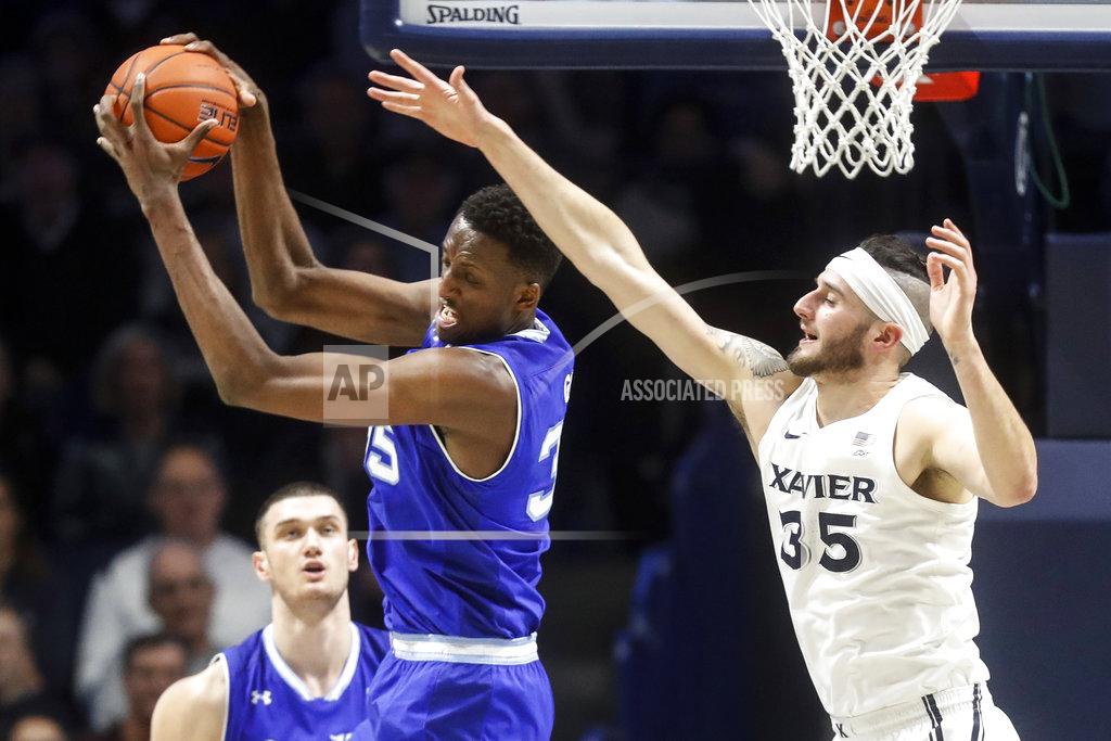 John Minchillo Seton Hall's Romaro Gill, left, pulls in a rebound next to Xavier's Zach Hankins during the second half of an NCAA college basketball game Wednesday, Jan. 2, 2019, in Cincinnati. (AP Photo/John Minchillo)