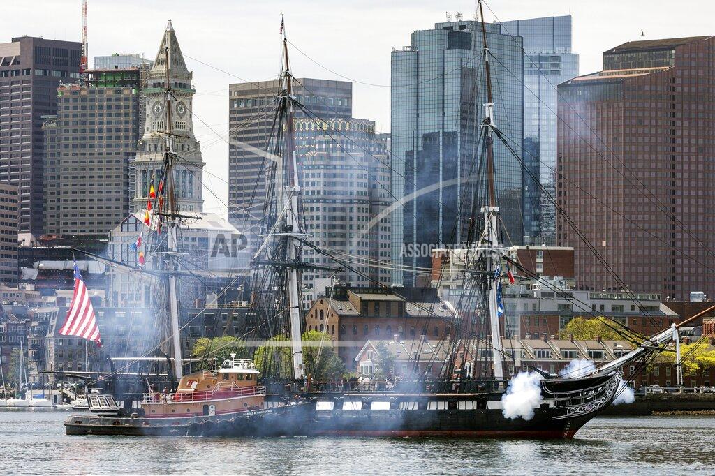 Michael Dwyer USS Constitution fires her canons while underway, Friday, May 21, 2021, in Boston. The ship will reopen to the public on Friday and celebrated with her first underway in more than a year due to COVID-19 pandemic. (AP Photo/Michael Dwyer)