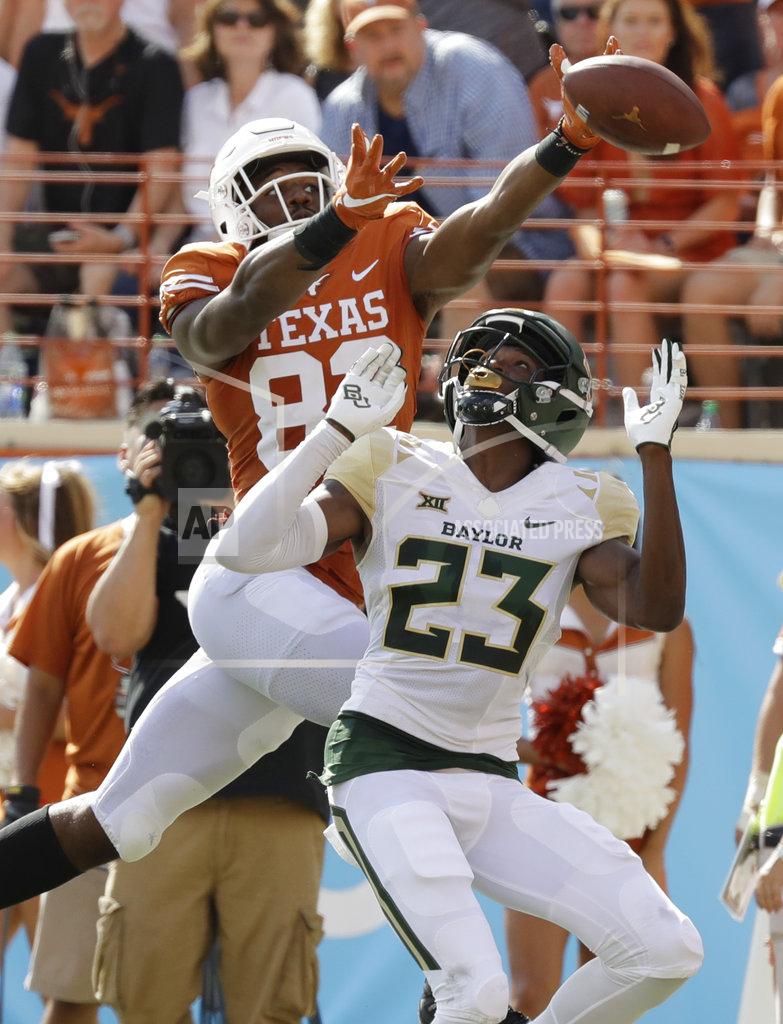 Eric Gay Texas wide receiver Brennan Eagles (82) fails to make a catch as he reaches over Baylor cornerback Derrek Thomas (23) during the first half of an NCAA college football game, Saturday, Oct. 13, 2018, in Austin, Texas. (AP Photo/Eric Gay)