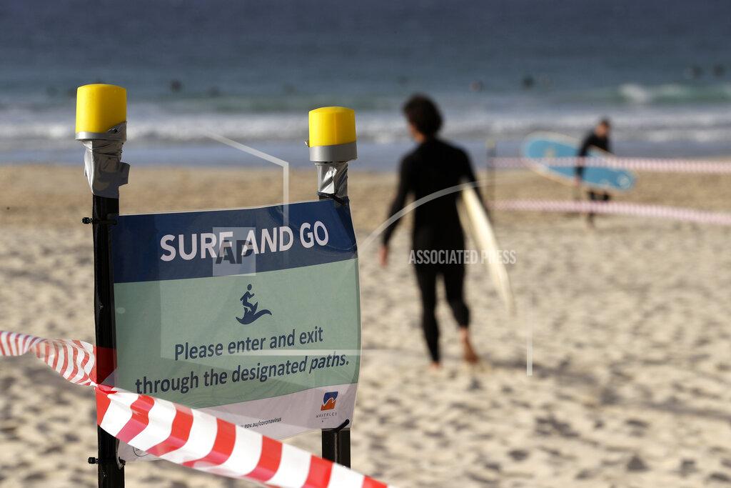 Rick Rycroft A sign tells surfers to leave once they have finished surfing at Bondi Beach in Sydney, Tuesday, April 28, 2020, as coronavirus pandemic restrictions are eased. The beach is open to swimmers and surfers to exercise only. (AP Photo/Rick Rycroft)