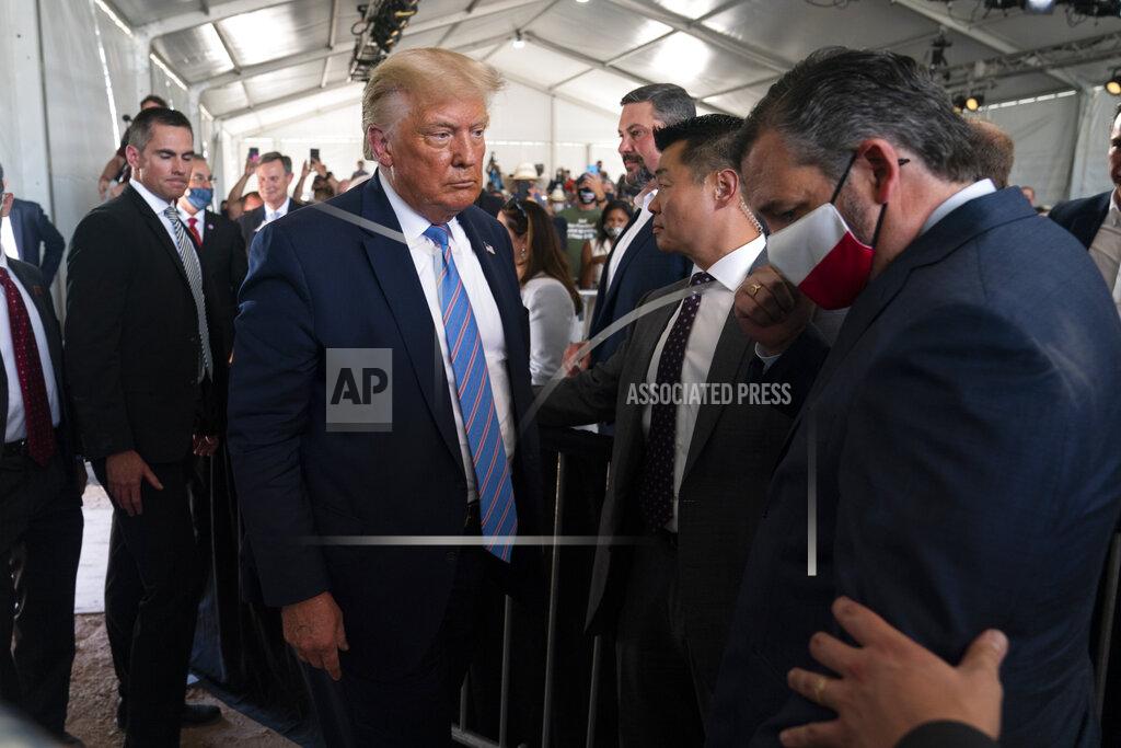 Evan Vucci President Donald Trump leaves after delivering remarks about American energy production during a visit to the Double Eagle Energy Oil Rig, Wednesday, July 29, 2020, in Midland, Texas. Sen. Ted Cruz, R-Texas, is at right. (AP Photo/Evan Vucci)