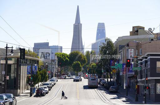FILE - This Oct. 11, 2020, file photo shows the Transamerica Pyramid, center, and Salesforce Tower above Columbus Avenue in San Francisco. A federal judge has approved a $5.4 million settlement on Friday, Nov. 19, 2021, between Transamerica and its current and former employees who accused the company of offering several poor performing investments in its employee retirement plan. (AP Photo/Eric Risberg, File)