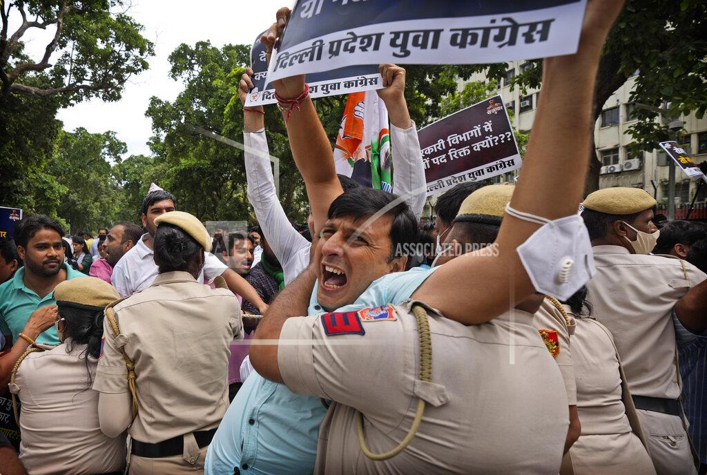 Manish Swarup A policeman detains an Indian Youth Congress member during a protest where he along with others held a protest to mark Indian Prime Minister Narendra Modi's birthday in New Delhi, India, Friday, Sept.17, 2021. Youth members of main opposition Congress party clashed with police during a street protest Friday demanding jobs as the country’s economy recovered from the impact of the COVID-19 pandemic that triggered massive unemployment in the country. The march took place as supporters of Prime Minister Narendra Modi celebrated his birthday as he turned 71 on Friday. (AP Photo/Manish Swarup)