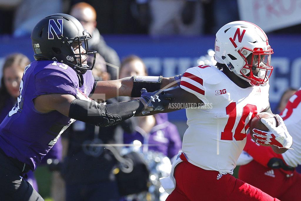 Jim Young Nebraska's JD Spielman, right, pushes off Northwestern's JR Pace on his way to scoring a touchdown iin the first half of an NCAA college football game Saturday, Oct. 13, 2018, in Evanston, Ill.. (AP Photo/Jim Young)