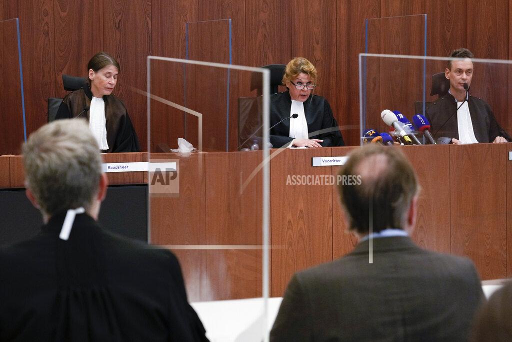 Peter Dejong Presiding judge Hofmeijer-Rutten, center, prepares to read the verdict in a Dutch appeals court in Amsterdam, Tuesday Oct. 26, 2021, on ownership of a trove of Crimean historical artifacts that were loaned to an Amsterdam museum shortly before Russia annexed the region. A lower court ruled in 2016 that the treasures should be handed to the Ukrainian government. (AP Photo/Peter Dejong, file)