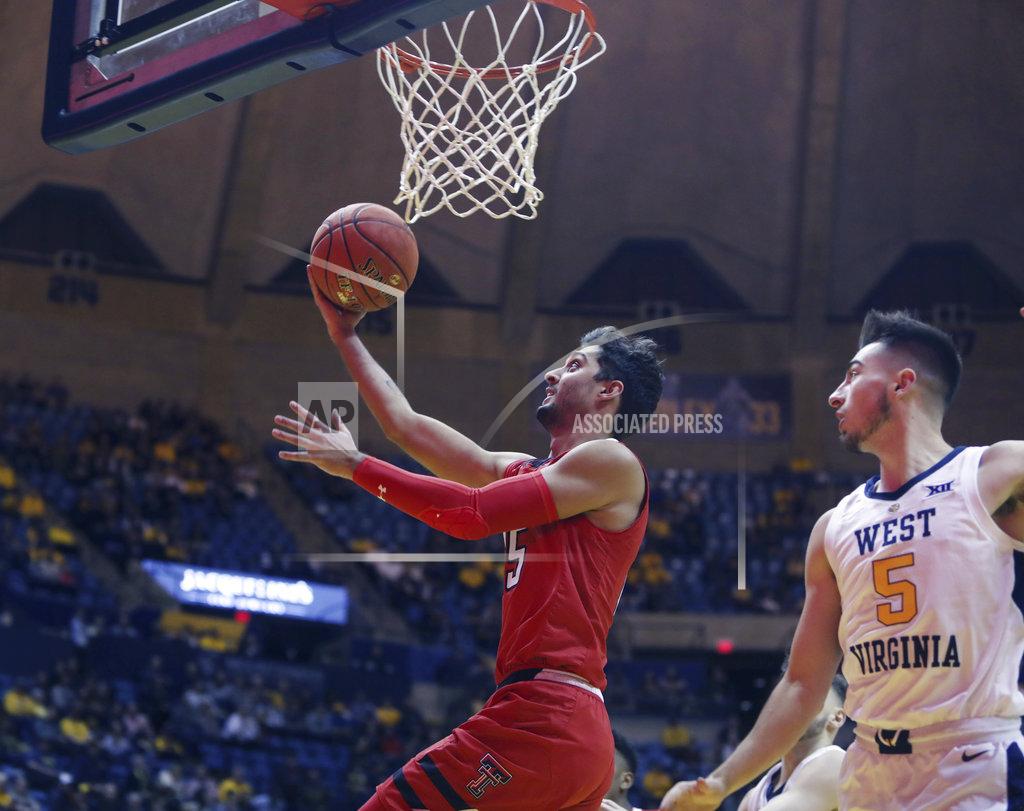 Ray Thompson Texas Tech guard Davide Moretti (25) drives while defended by West Virginia guard Jordan McCabe (5) during the first half of an NCAA college basketball game Wednesday, Jan. 2, 2019, in Morgantown, W.Va. (AP Photo/Raymond Thompson)