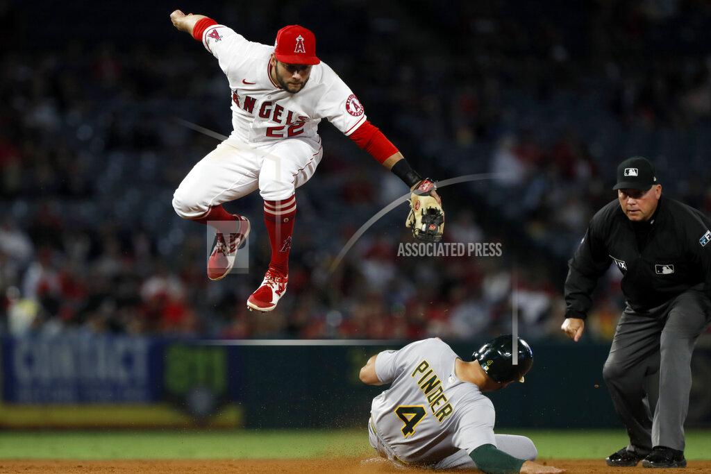 Alex Gallardo Oakland Athletics' Chad Pinder slides under Los Angeles Angels second baseman David Fletcher for a stolen base during the sixth inning of a baseball game in Anaheim, Calif., Saturday, Sept. 18, 2021. (AP Photo/Alex Gallardo)