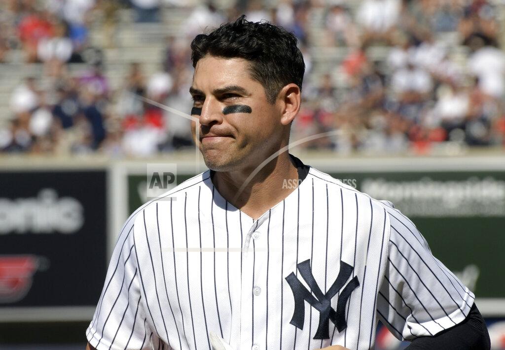 CORRECTS TO ONE GUARANTEED SEASON, INSTEAD OF TWO - FILE - In this Aug. 30, 2017, file photo, New York Yankees' Jacoby Ellsbury reacts after grounding out to end the sixth inning in the first game of the baseball team's doubleheader against the Cleveland Indians at Yankee Stadium in New York. The Yankees have given up on Ellsbury, cutting the oft-injured outfielder with one guaranteed season and more than $26 million left in his $153 million, seven-year contract. (AP Photo/Bill Kostroun, File)