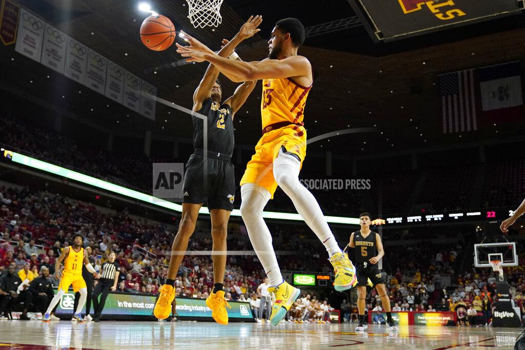 Charlie Neibergall Iowa State guard Tristan Enaruna (23) passes over Alabama State forward Jordan O'Neal (2) during the first half of an NCAA college basketball game, Tuesday, Nov. 16, 2021, in Ames, Iowa. (AP Photo/Charlie Neibergall)