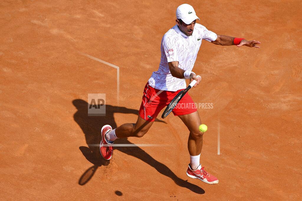 Alfredo Falcone Serbia's Novak Djokovic returns the ball to Italy's Salvatore Caruso, at the Italian Open tennis tournament in Rome, Wednesday, Sept. 16, 2020. (Alfredo Falcone/LaPresse via AP)