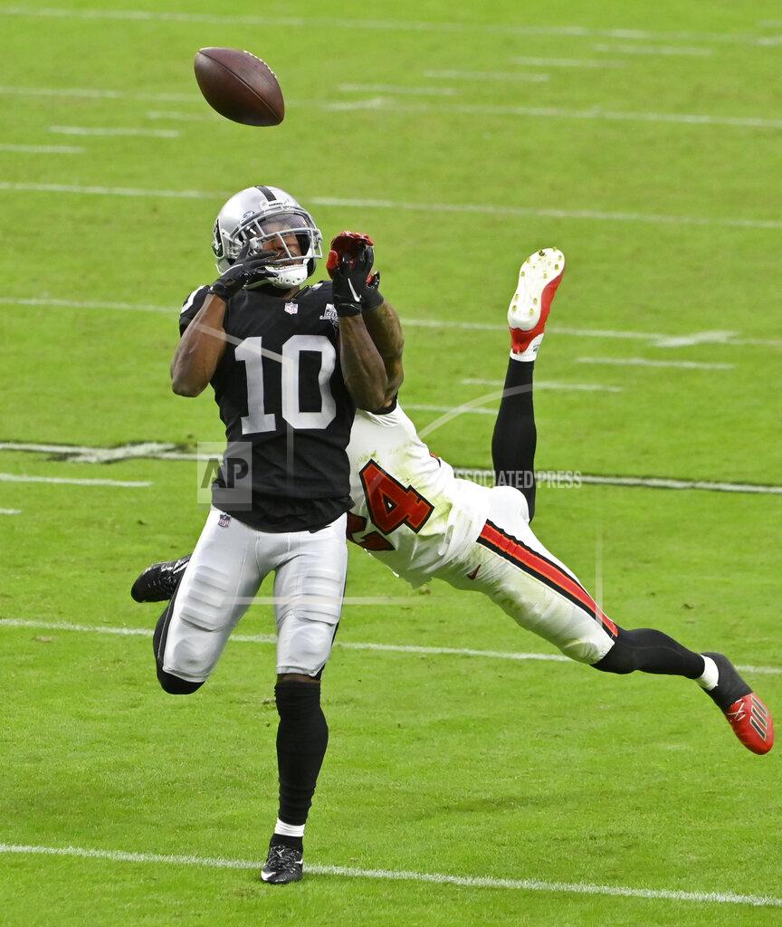 David Becker Las Vegas Raiders wide receiver Rico Gafford (10) misses a catch while guarded by Tampa Bay Buccaneers cornerback Carlton Davis (24) during the second half of an NFL football game, Sunday, Oct. 25, 2020, in Las Vegas. (AP Photo/David Becker)