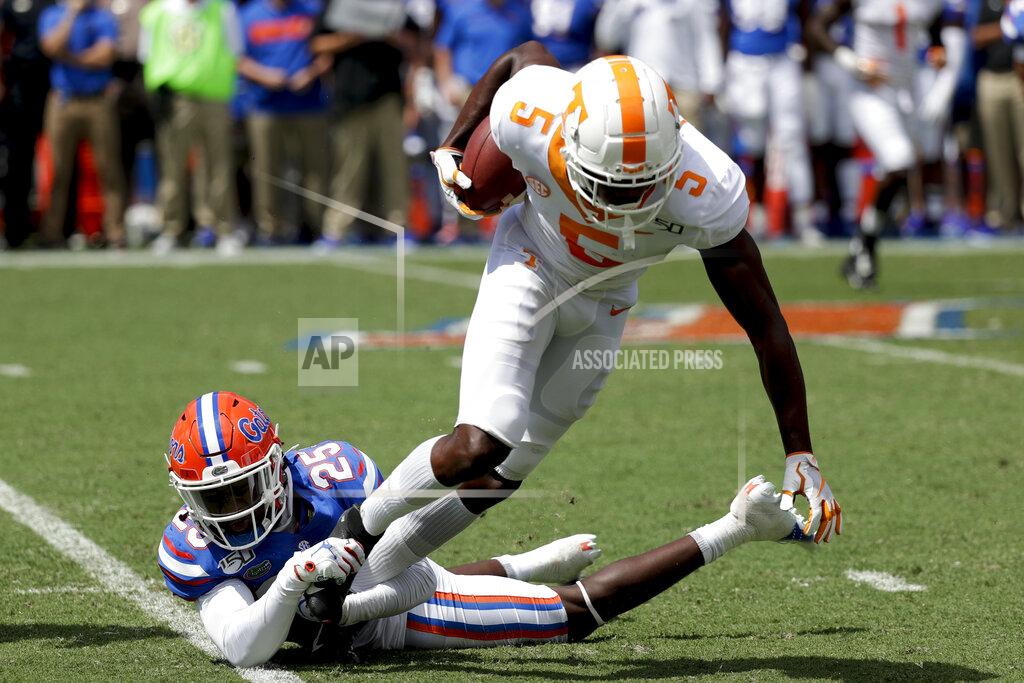 John Raoux Florida defensive back Chester Kimbrough (25) stops Tennessee wide receiver Josh Palmer (5) after a reception during the first half of an NCAA college football game, Saturday, Sept. 21, 2019, in Gainesville, Fla. (AP Photo/John Raoux)