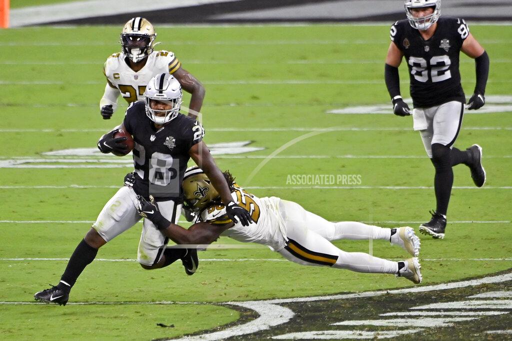 David Becker New Orleans Saints outside linebacker Demario Davis (56) tackles Las Vegas Raiders running back Josh Jacobs (28) during the second half of an NFL football game, Monday, Sept. 21, 2020, in Las Vegas. (AP Photo/David Becker)