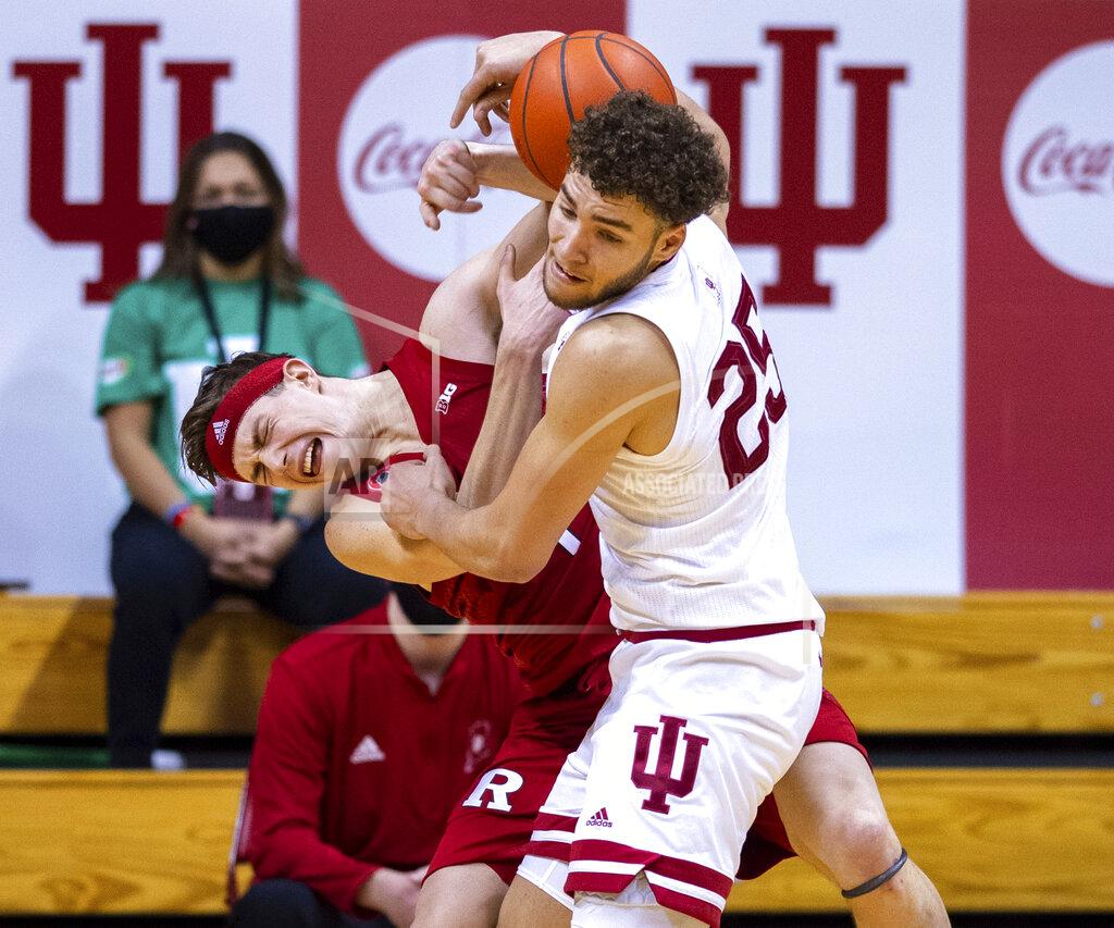 Doug Mcschooler Rutgers guard Paul Mulcahy, left, and Indiana forward Race Thompson, right, battle for a rebound during the second half of an NCAA college basketball game, Sunday, Jan. 24, 2021, in Bloomington, Ind. (AP Photo/Doug McSchooler)