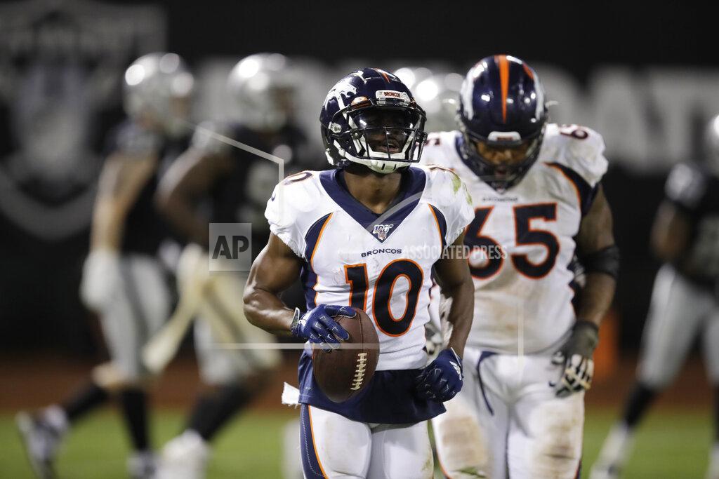 Ben Margot Denver Broncos wide receiver Emmanuel Sanders (10) returns to the bench after scoring a touchdown during the second half of an NFL football game against the Oakland Raiders Monday, Sept. 9, 2019, in Oakland, Calif. Oakland won the game 24-16. At right is Broncos offensive guard Ronald Leary (65). (AP Photo/Ben Margot)