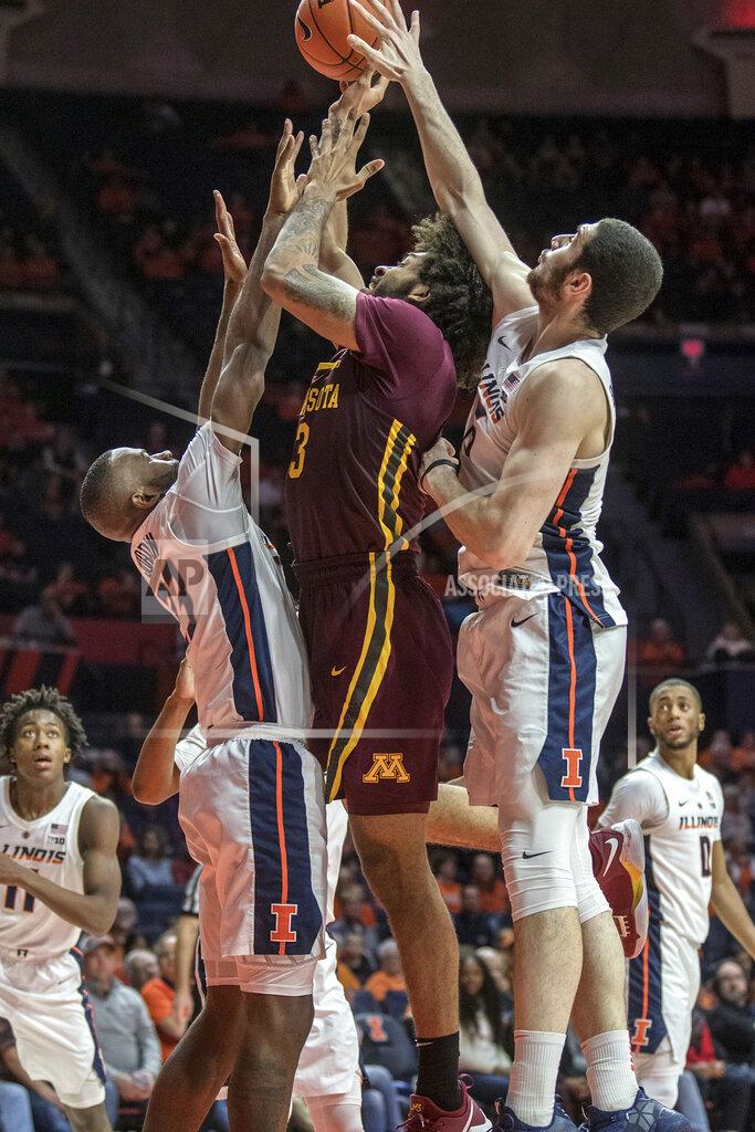 Rick Danzl Minnesota forward Jordan Murphy (3) tries to shoot between Illinois guard Aaron Jordan, left, and forward Giorgi Bezhanishvili (15) during the second half of an NCAA college basketball game in Champaign, Ill., Wednesday, Jan. 16, 2019. (AP Photo/Rick Danzl)