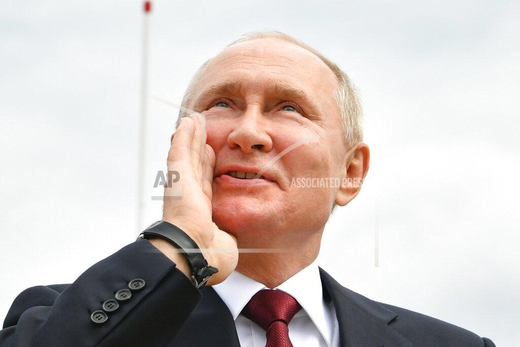 Alexei Nikolsky Russian President Vladimir Putin shouts to spectators as he leaves the Navy Day parade in St. Petersburg, Russia, Sunday, July 25, 2021. (Alexei Nikolsky, Sputnik, Kremlin Pool Photo via AP)