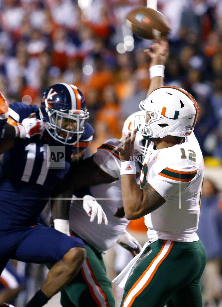 Steve Helber Miami quarterback Malik Rosier (12) passes as Virginia linebacker Charles Snowden (11) closes in during the first half of an NCAA college football game in Charlottesville, Va., Saturday, Oct. 13, 2018. (AP Photo/Steve Helber)