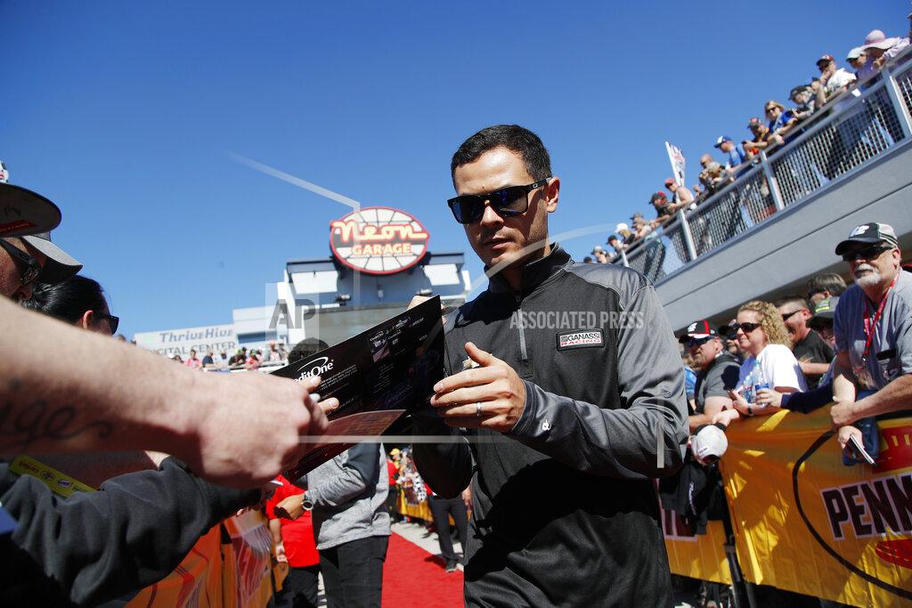 John Locher Kyle Larson gives autographs before a NASCAR Cup Series auto race at Las Vegas Motor Speedway, Sunday, March 3, 2019, in Las Vegas. (AP Photo/John Locher)