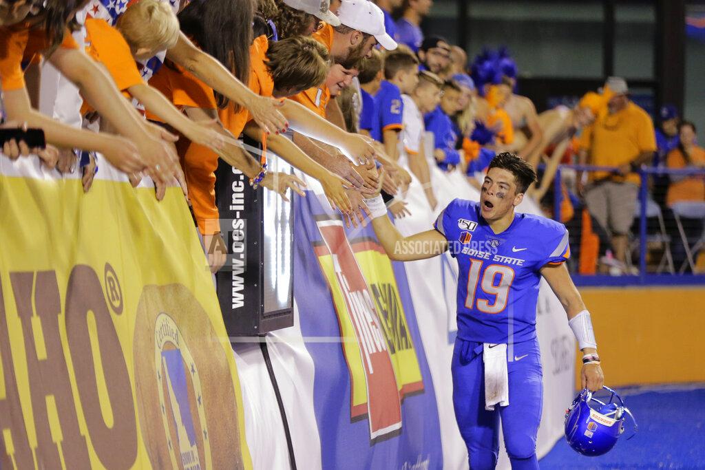 Otto Kitsinger Boise State quarterback Hank Bachmeier high-fives fans after the team's NCAA college football game against Marshall in Boise, Idaho, Friday, Sept. 6, 2019. Boise State won 14-7. (AP Photo/Otto Kitsinger)