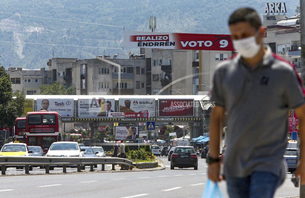 Boris Grdanoski Various electoral campaign posters and banners are displayed over a street in Skopje, North Macedonia on Saturday, July 11, 2020. North Macedonia holds its first parliamentary election under its new country name this week, with voters heading to the polls during an alarming spike of coronavirus cases in the small Balkan nation. (AP Photo/Boris Grdanoski)