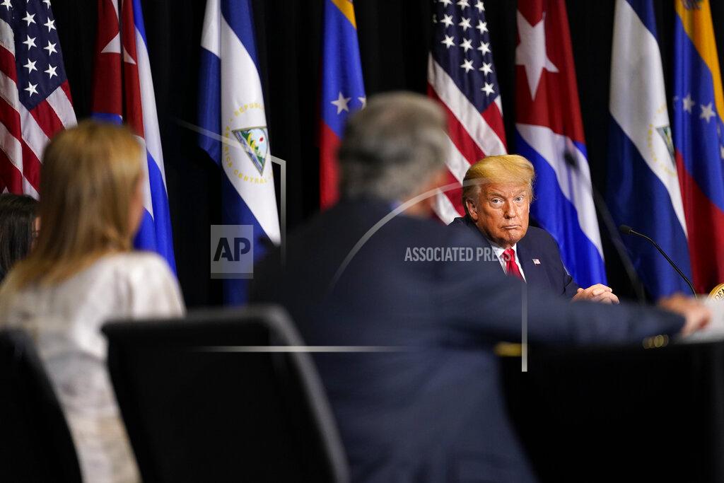 Evan Vucci President Donald Trump listens during a roundtable on Venezuela at Iglesia Doral Jesus Worship Center, Friday, July 10, 2020, in Doral, Fla. (AP Photo/Evan Vucci)