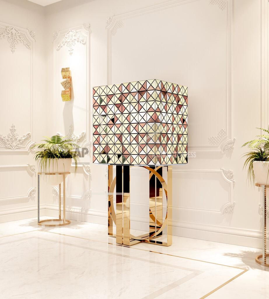 Uncredited This image released by Boca do Lobo shows the Pixel bar cabinet, clad in over a thousand multicolored triangles made of woods like palisander and African walnut, evoking a pixelated image. Inside, mirror and diamond-quilted blue silk showcases nine drawers, each with a golden knob. (Boca do Lobo via AP)