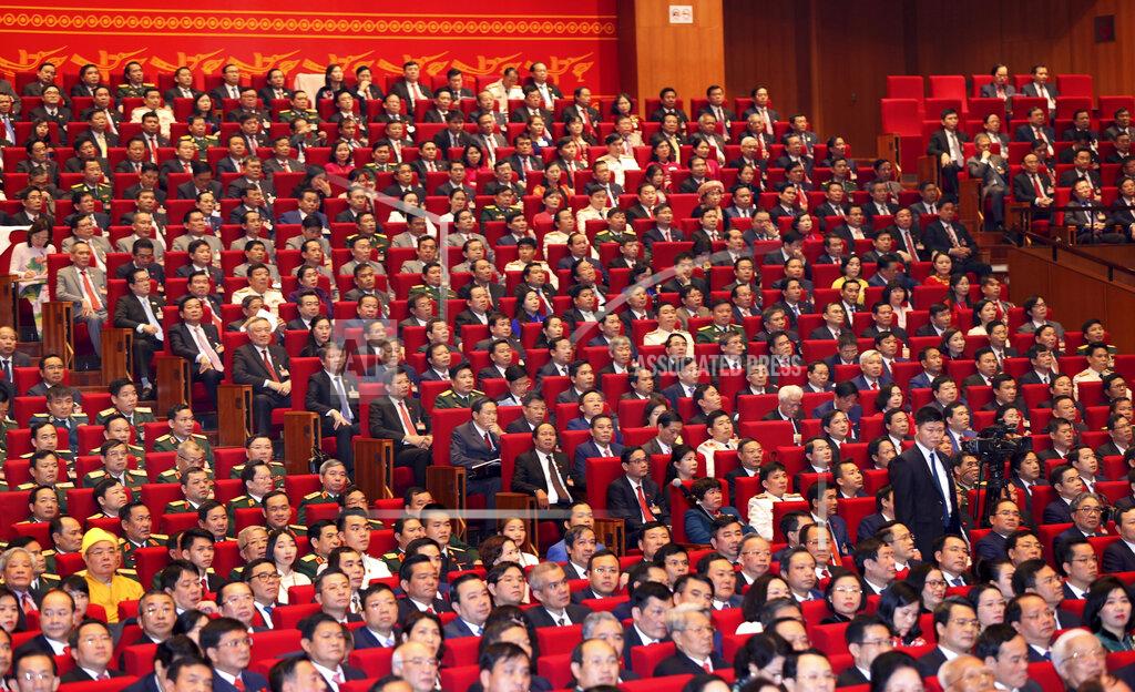 Bui Lam Khanh Delegates attend the opening of 13th Communist Party Congress in Hanoi, Vietnam on Tuesday, Jan. 26, 2021. Vietnam's ruling Communist Party has begun a crucial weeklong meeting in the capital Hanoi to set the nation's path for the next five years and appoint the country's top leaders. (Bui Lam Khanh/VNA via AP)
