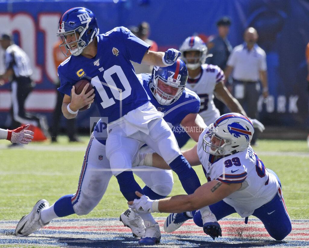 Bill Kostroun New York Giants quarterback Eli Manning (10) fumbles the ball as he is tackled behind the line of scrimmage during the second half of an NFL football game against the Buffalo Bills, Sunday, Sept. 15, 2019, in East Rutherford, N.J. (AP Photo/Bill Kostroun)