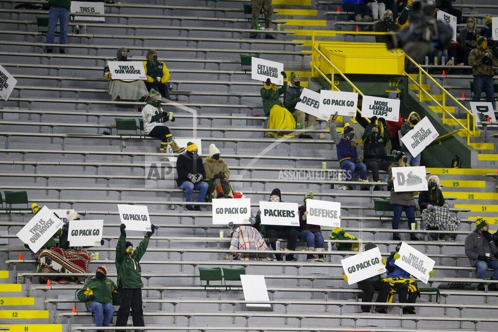Mike Roemer A limited number of fans watch during the second half of an NFL football game between the Green Bay Packers and the Philadelphia Eagles at Lambeau Field Sunday, Dec. 6, 2020, in Green Bay, Wis. (AP Photo/Mike Roemer)