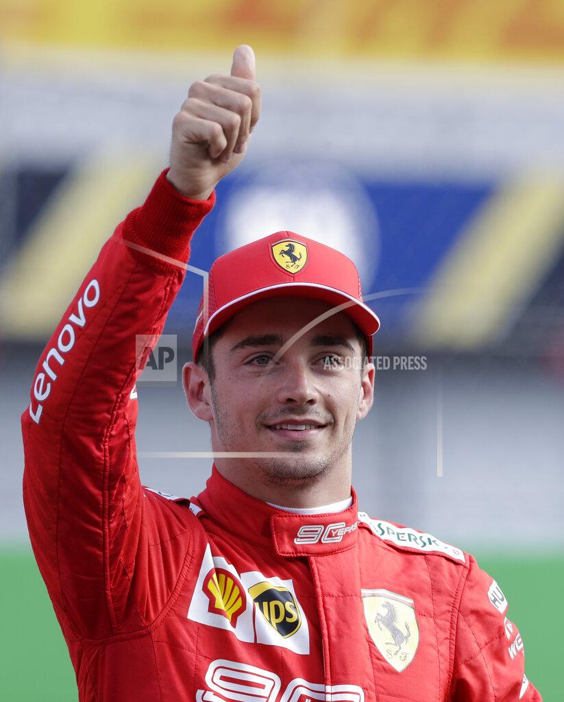 Ferrari driver Charles Leclerc of Monaco celebrates taking pole position during the qualifying session at the Monza racetrack, in Monza, Italy, Saturday, Sept. 7, 2019. The Formula one race will be held on Sunday. (AP Photo/Luca Bruno)