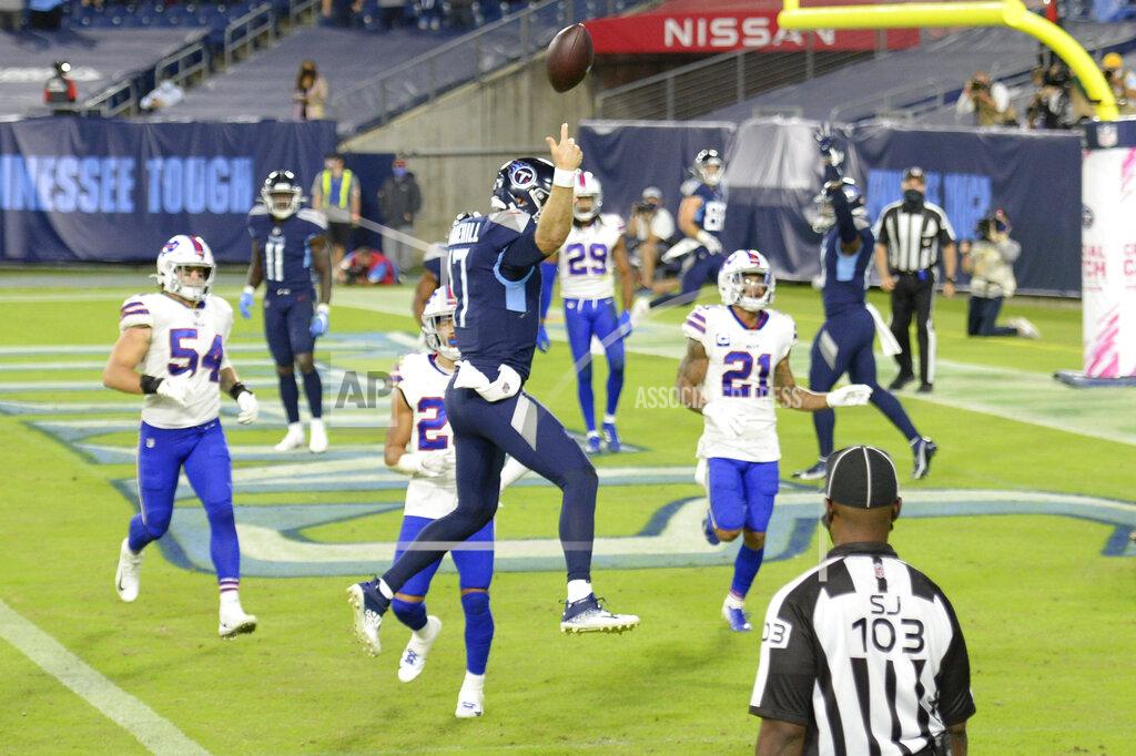 Mark Zaleski Tennessee Titans quarterback Ryan Tannehill (17) leaps into the end zone as he scores a touchdown against the Buffalo Bills on a 10-yard run in the first half of an NFL football game Tuesday, Oct. 13, 2020, in Nashville, Tenn. (AP Photo/Mark Zaleski)